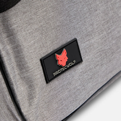 Gray bag with a black patch featuring a red wolf logo and 'ProtecWolf' text.