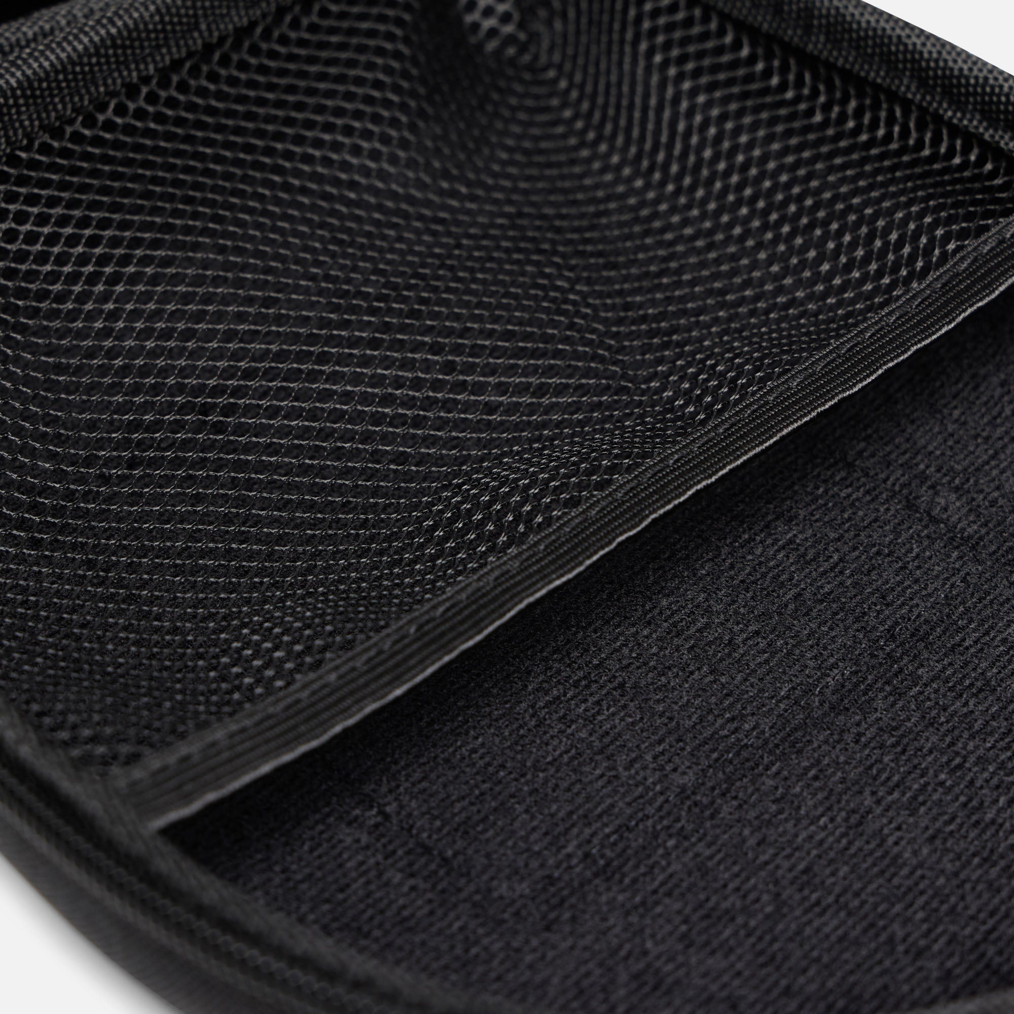 Internal mesh storage pocket inside ProtecWolf headphone case