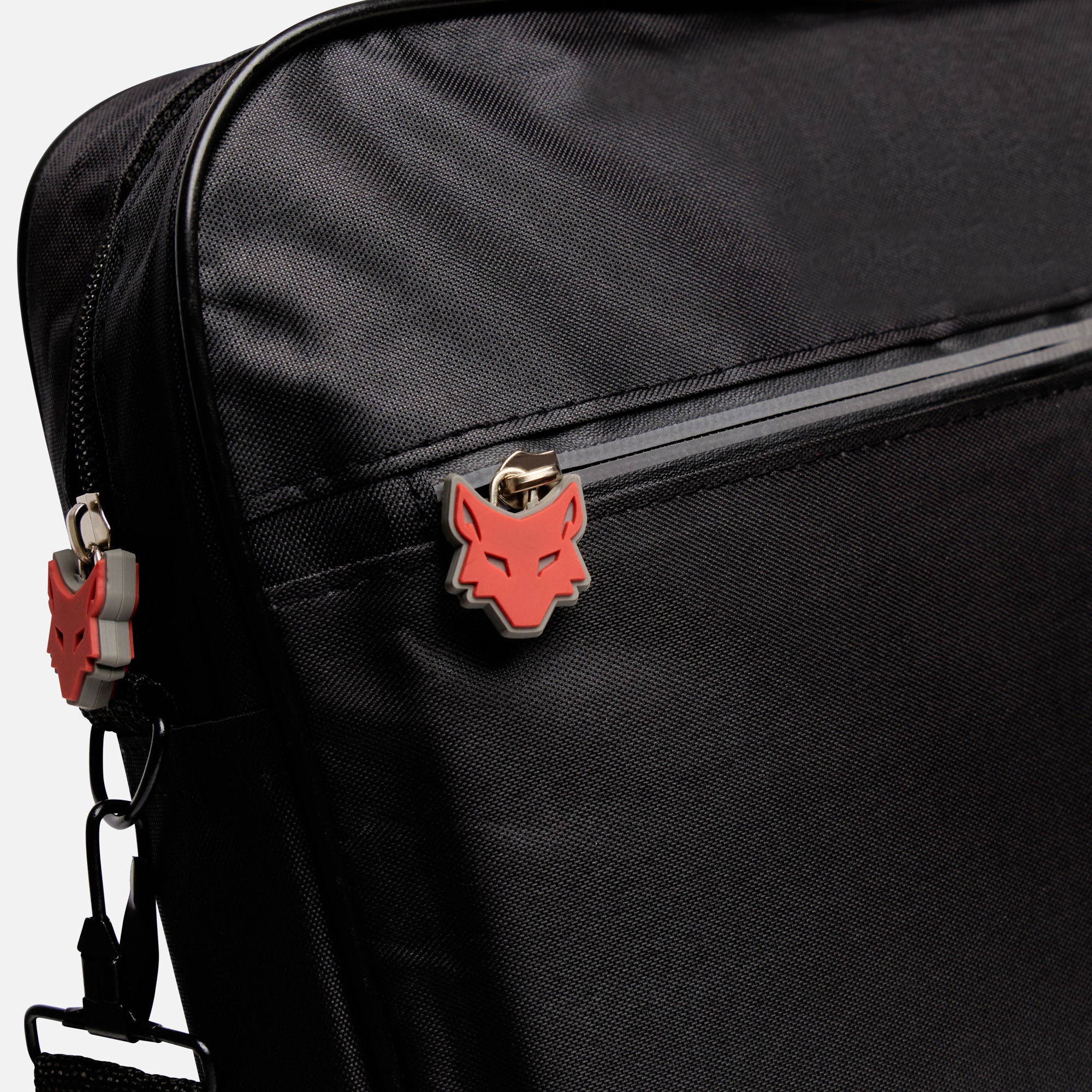 Black bag with a red and grey wolf emblem on a white background
