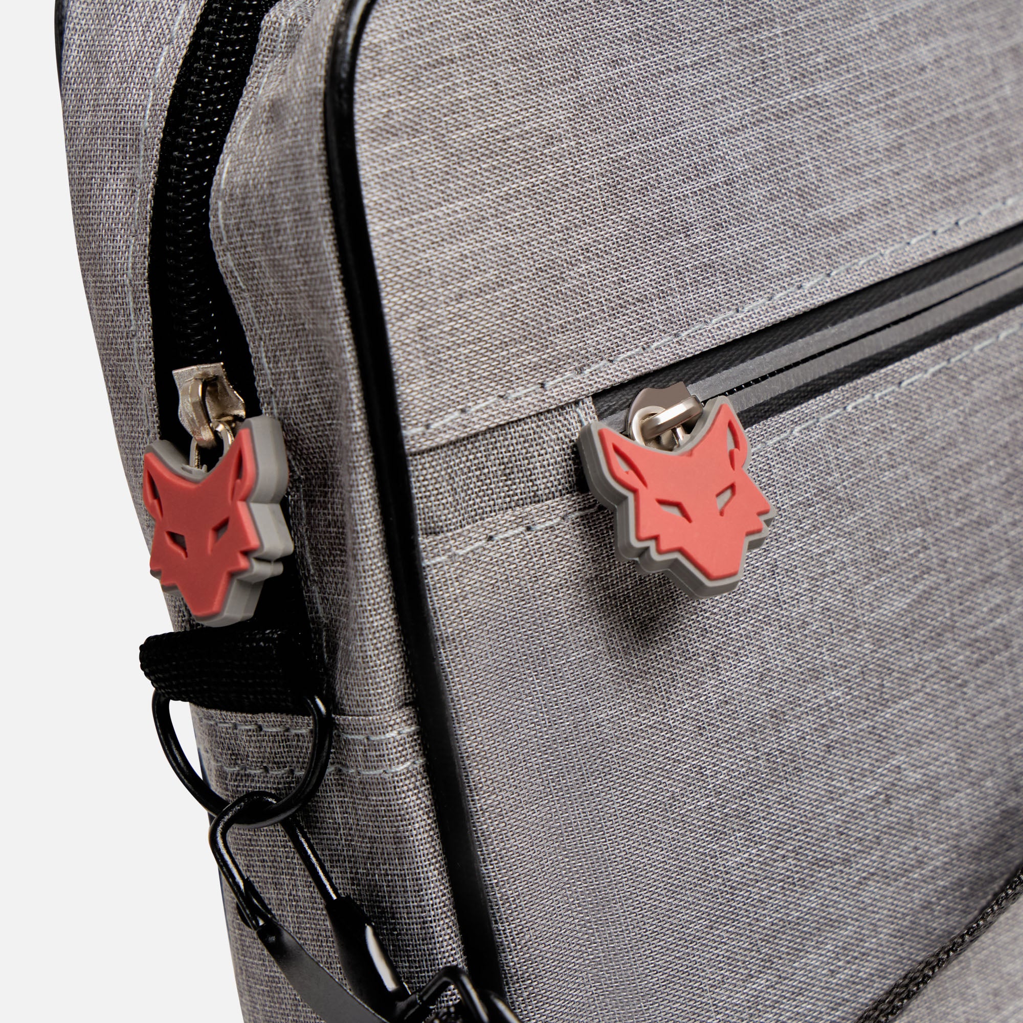 Gray backpack with red wolf emblem on a white background
