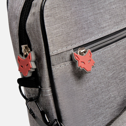 Gray backpack with red wolf emblem on a white background